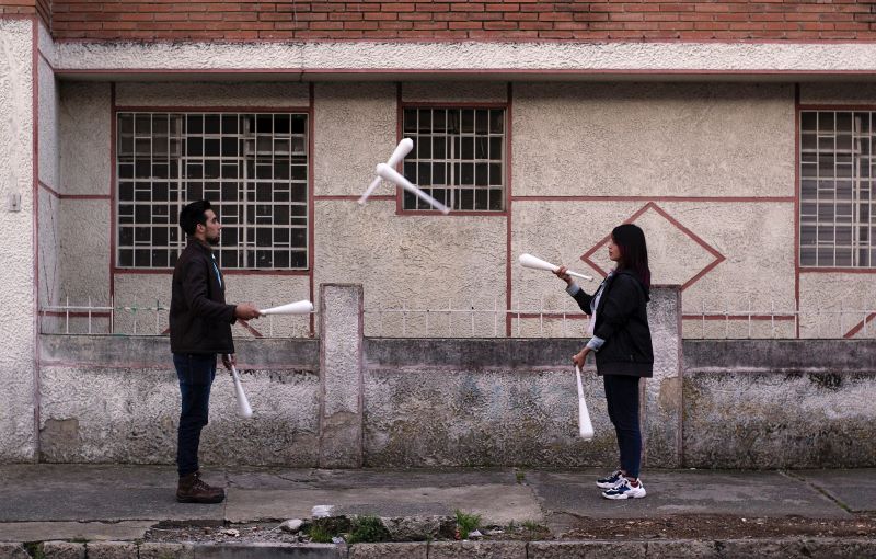 juggling couple illustrates metaphor of managing multiple wips